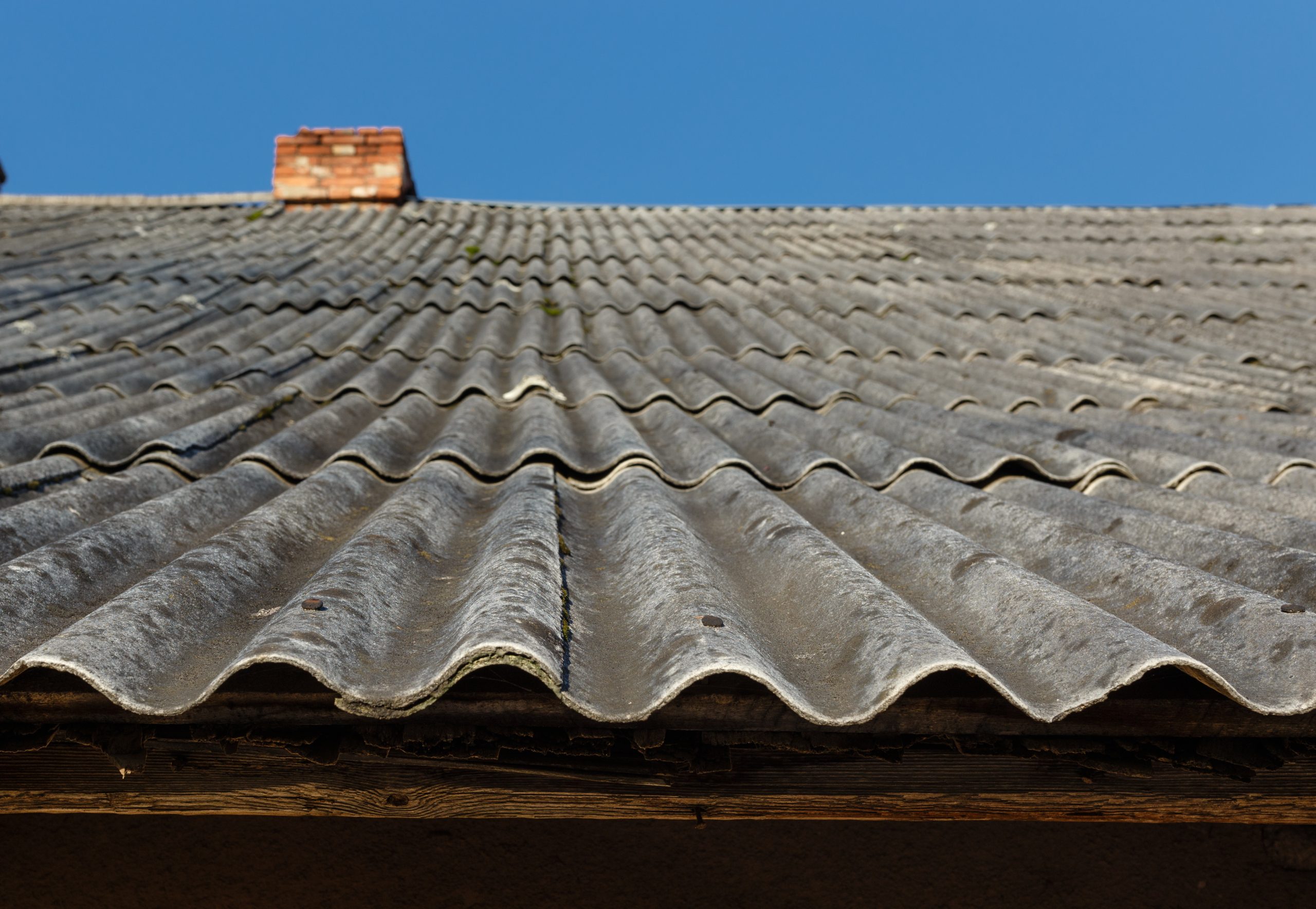 Asbestos cement roof spray foam encapsulation