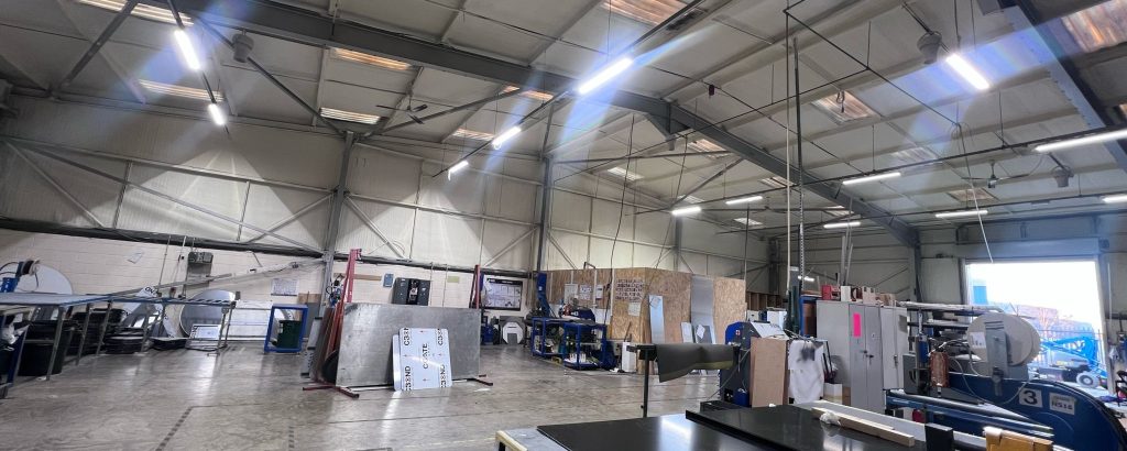Nuneaton, England: the same Enverge Nexseal LE closed-cell system, sprayed in a working warehouse (UK project).