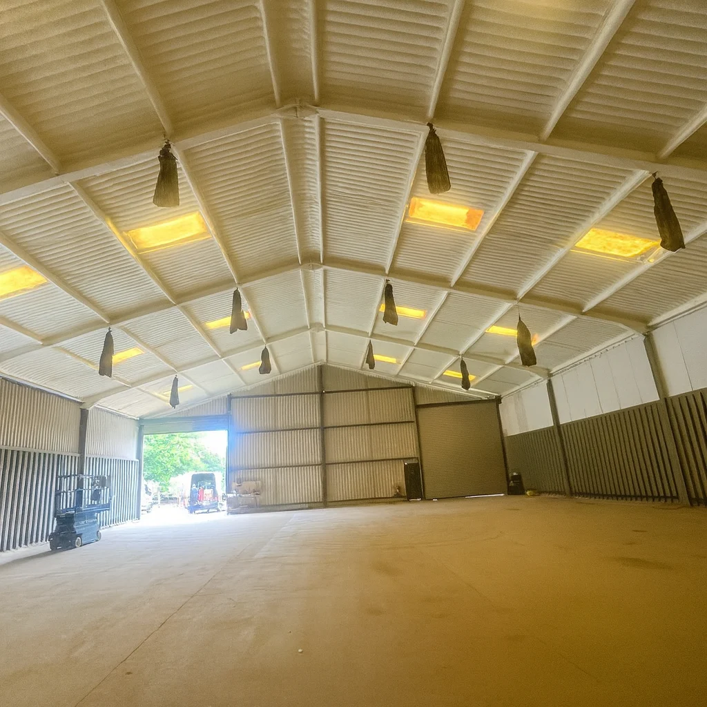 Enverge Nexseal LE closed-cell spray foam applied to a metal corrugated roof