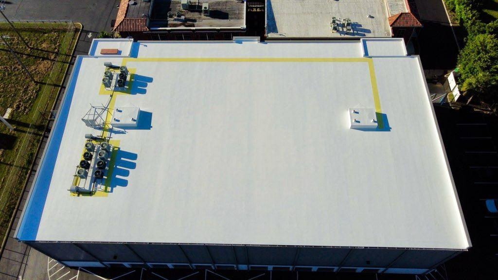 White reflective GacoFlex roof refurbishment like the academy cool-roof project