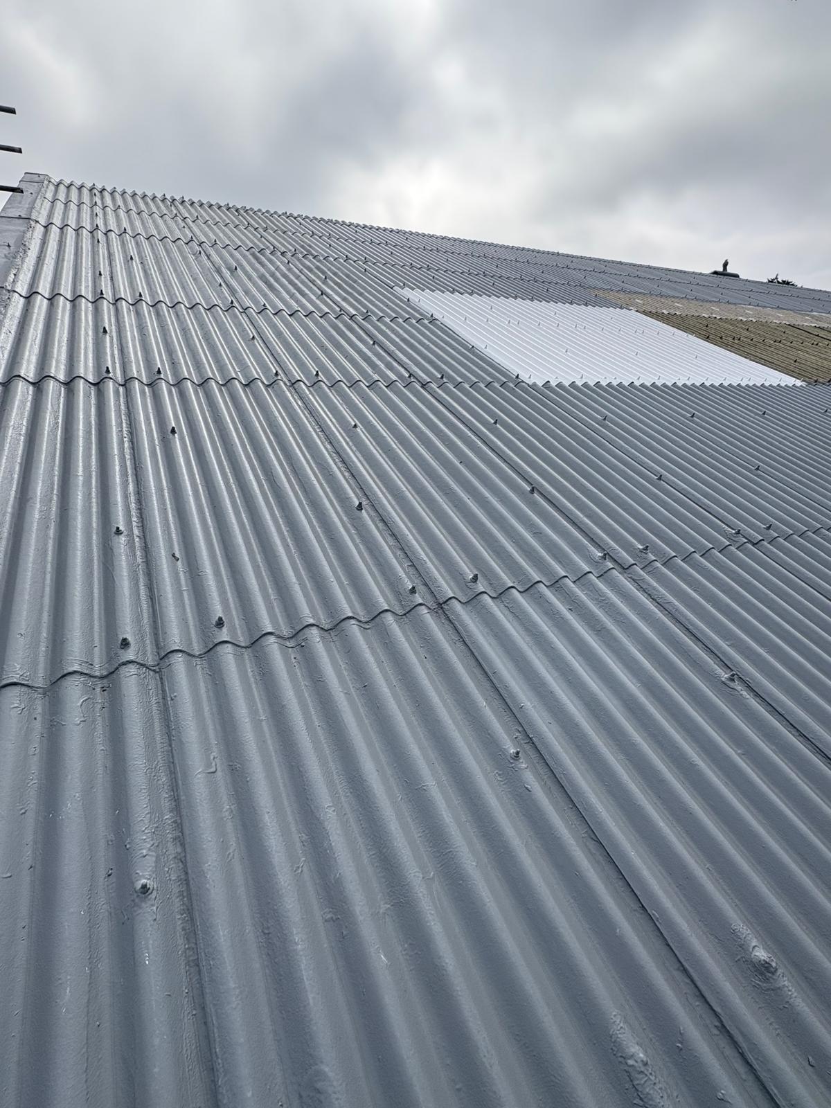 Asbestos-cement roof refurbished by encapsulation with Gaco silicone