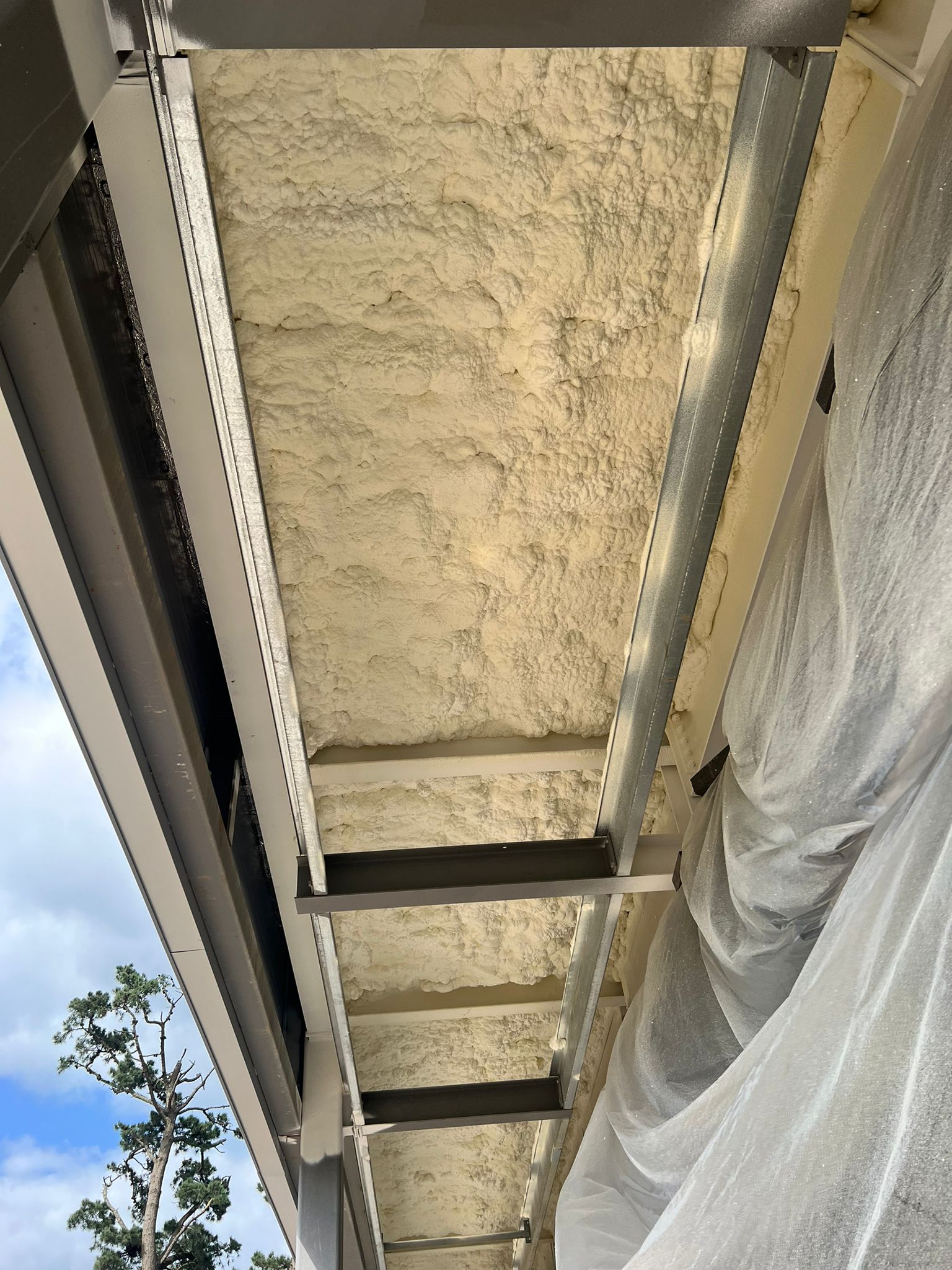 Distribution centre warehouse soffit with closed-cell foam and DC315 finish