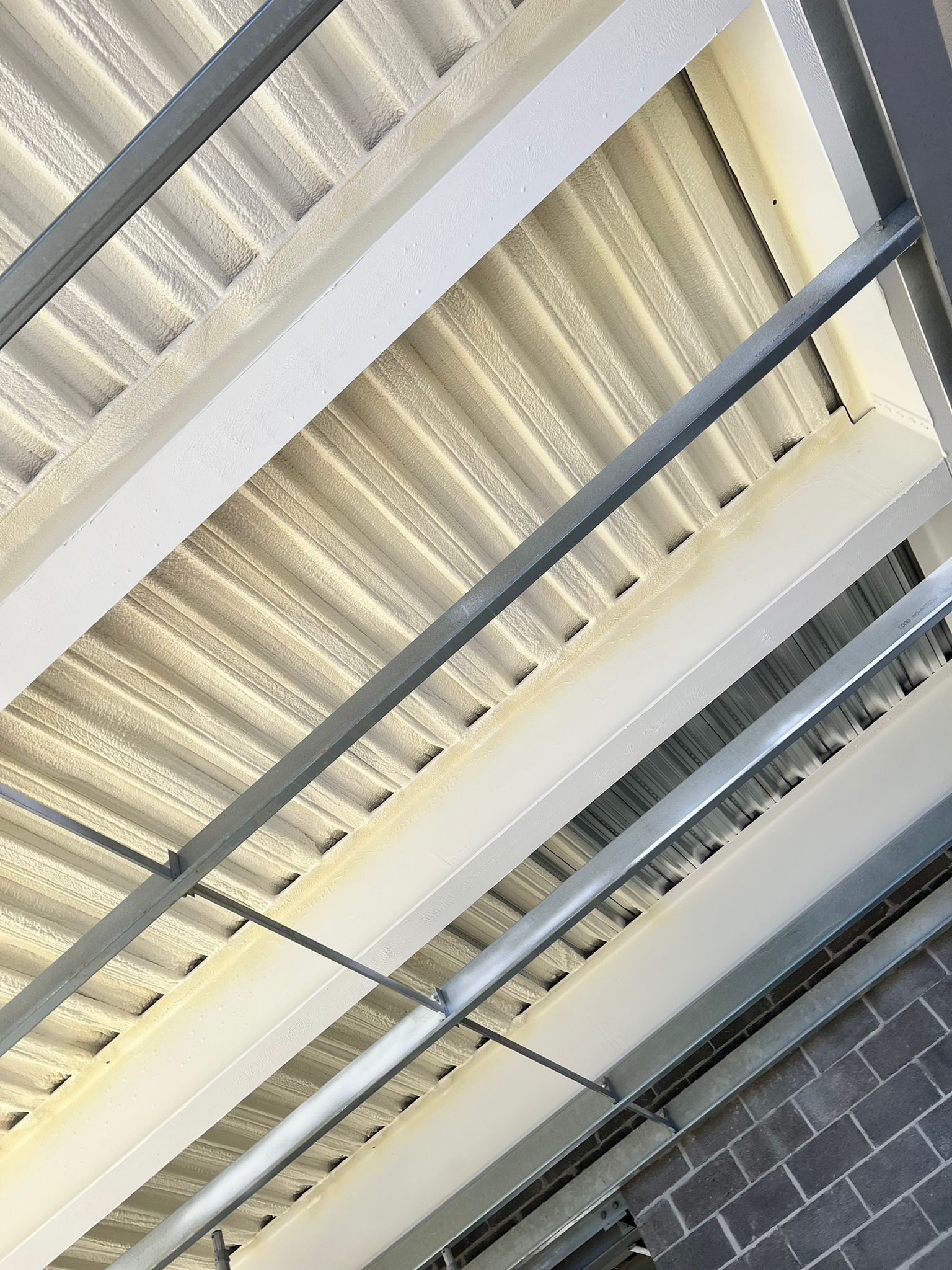 Mezzanine deck soffit underside with Nexseal LE applied