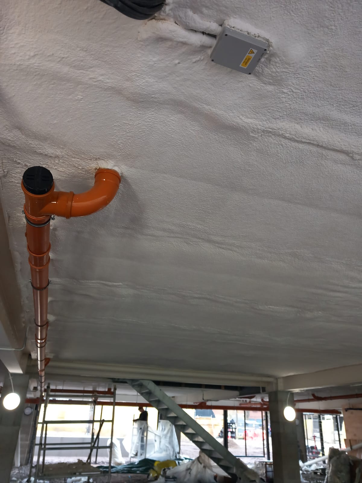 School building soffit with DC315 intumescent fire coating
