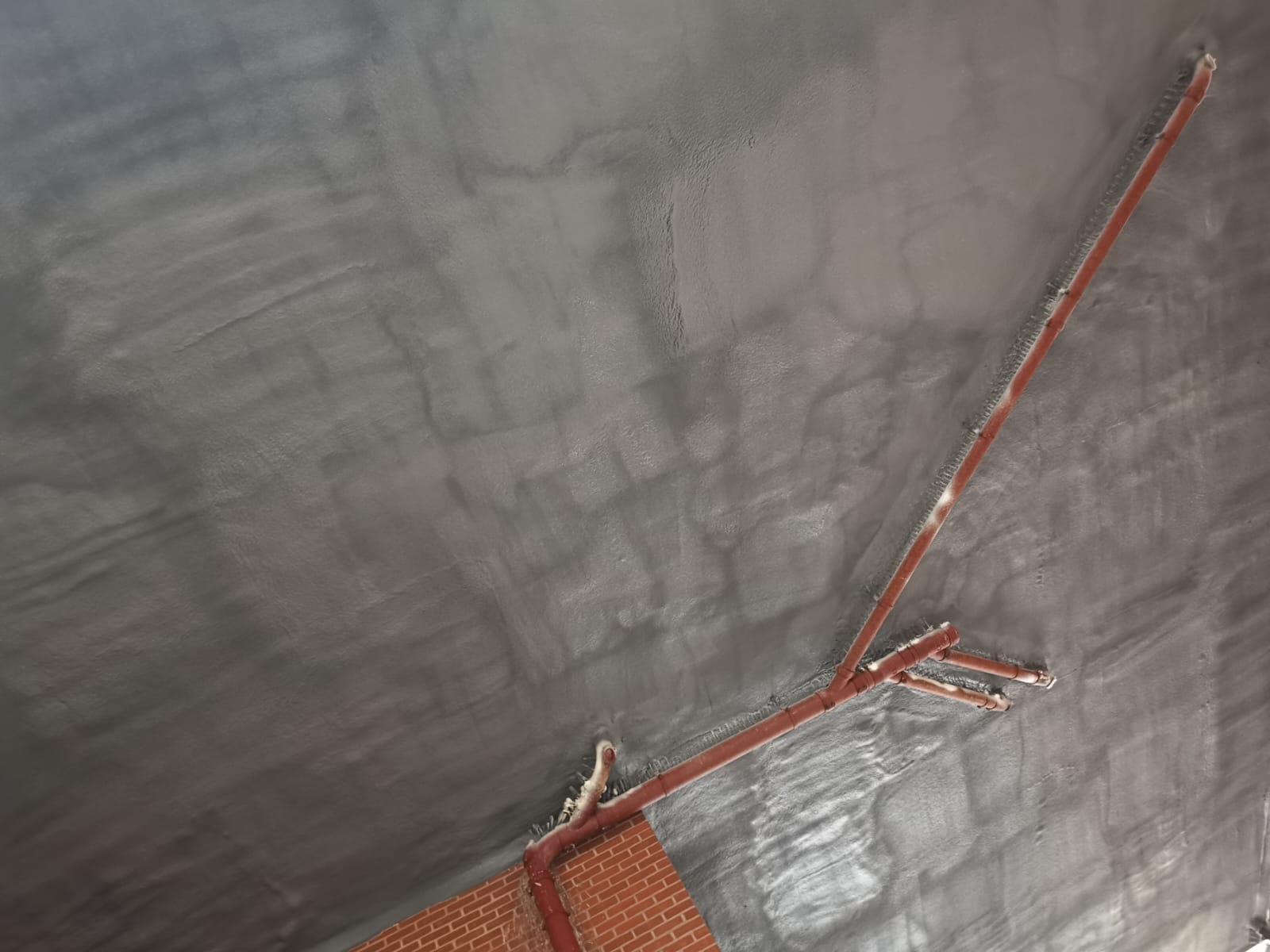 Retail unit ceiling soffit with DC315 intumescent topcoat