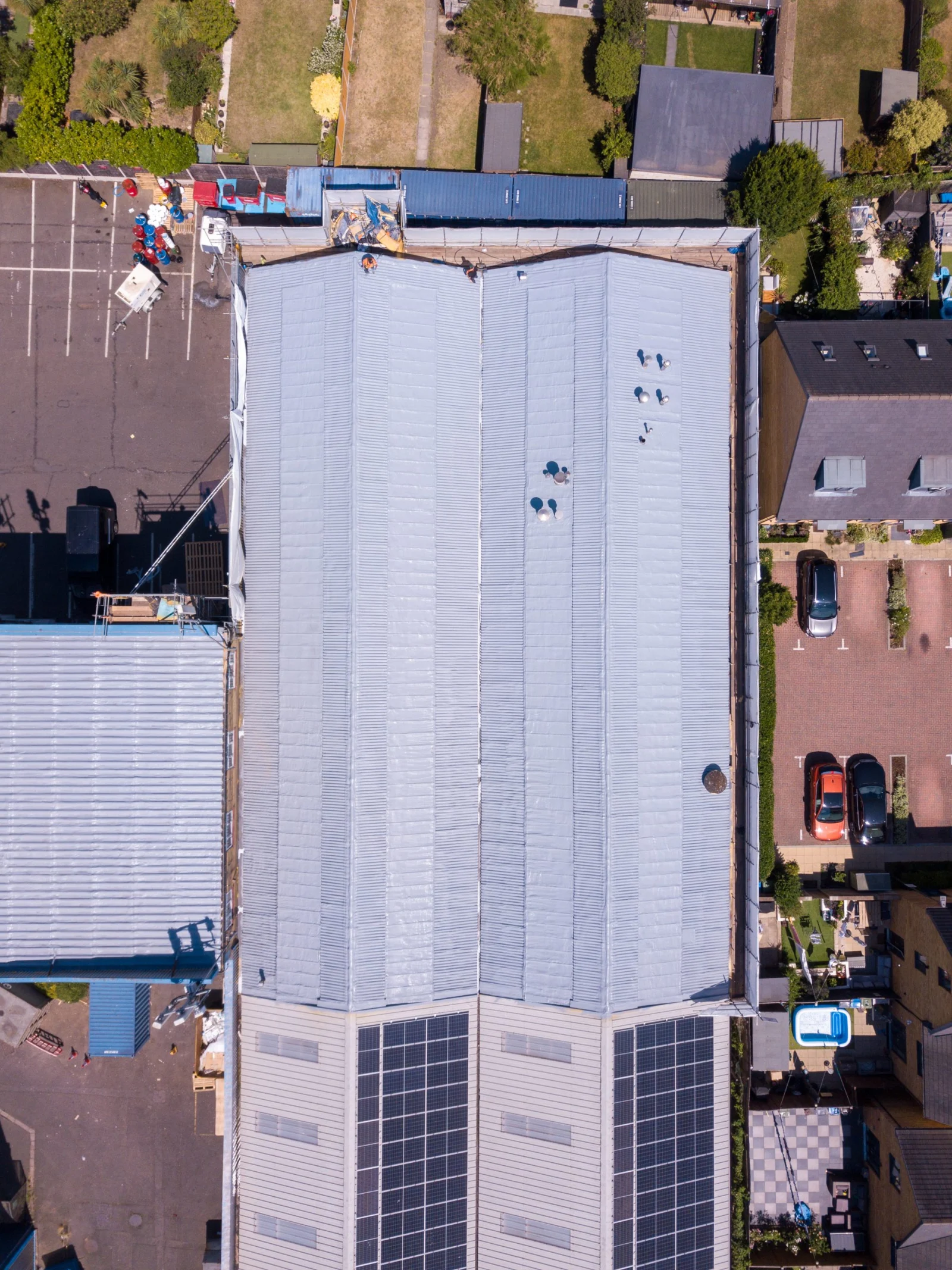 Top-down aerial of a commercial roof finished with a seamless GacoFlex overlay