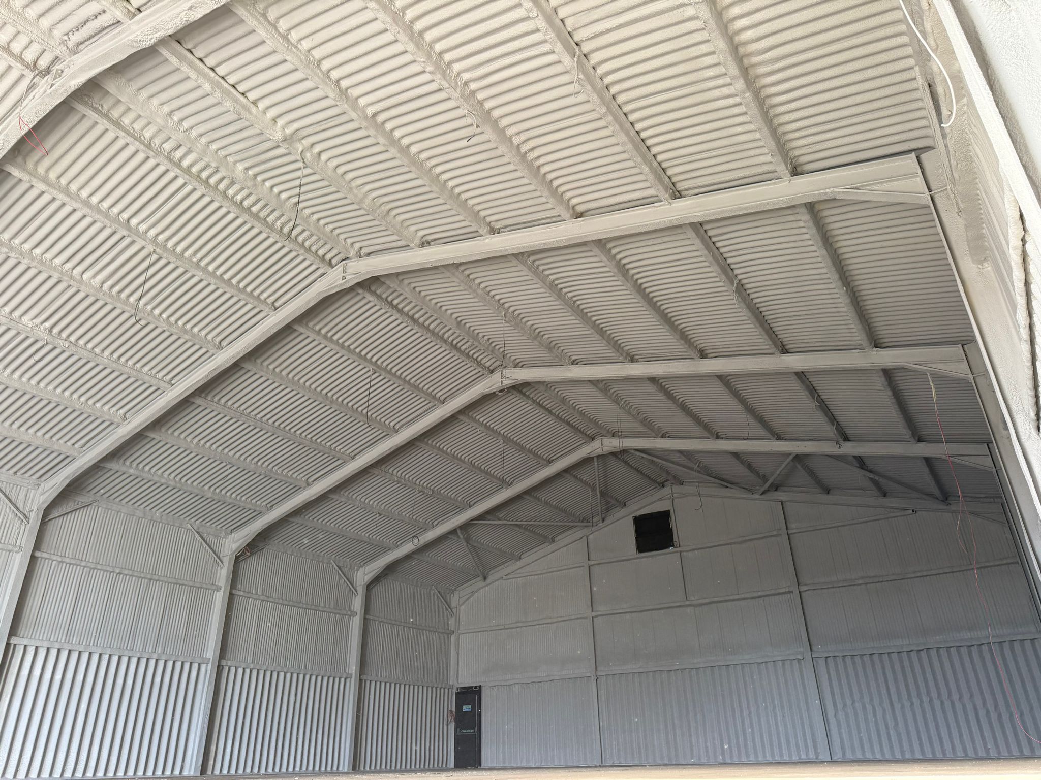 Finished underside encapsulation across the full apex of an asbestos cement roof