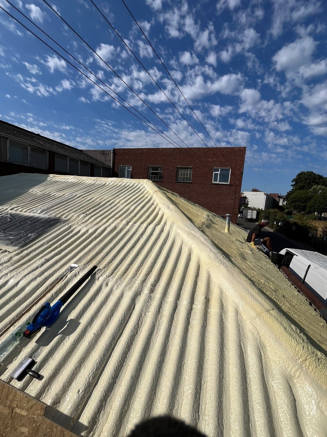 Purios HR closed-cell roofing foam built to 25 mm, following the corrugated profile