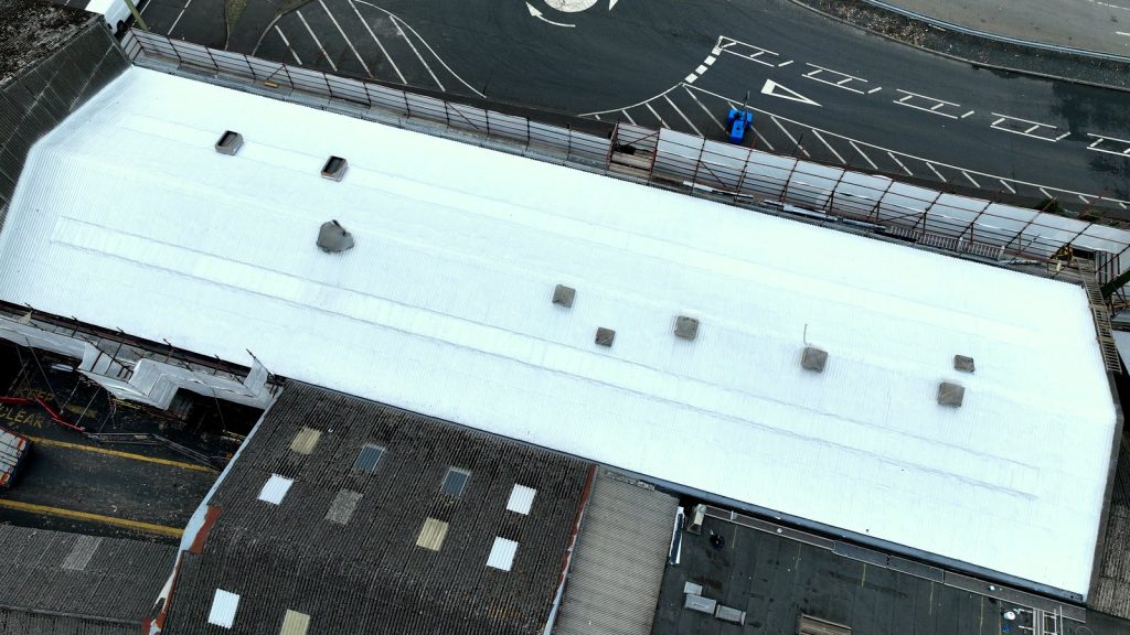Completed white coating on an asbestos cement roof at SAICA, Warrenpoint, County Down.